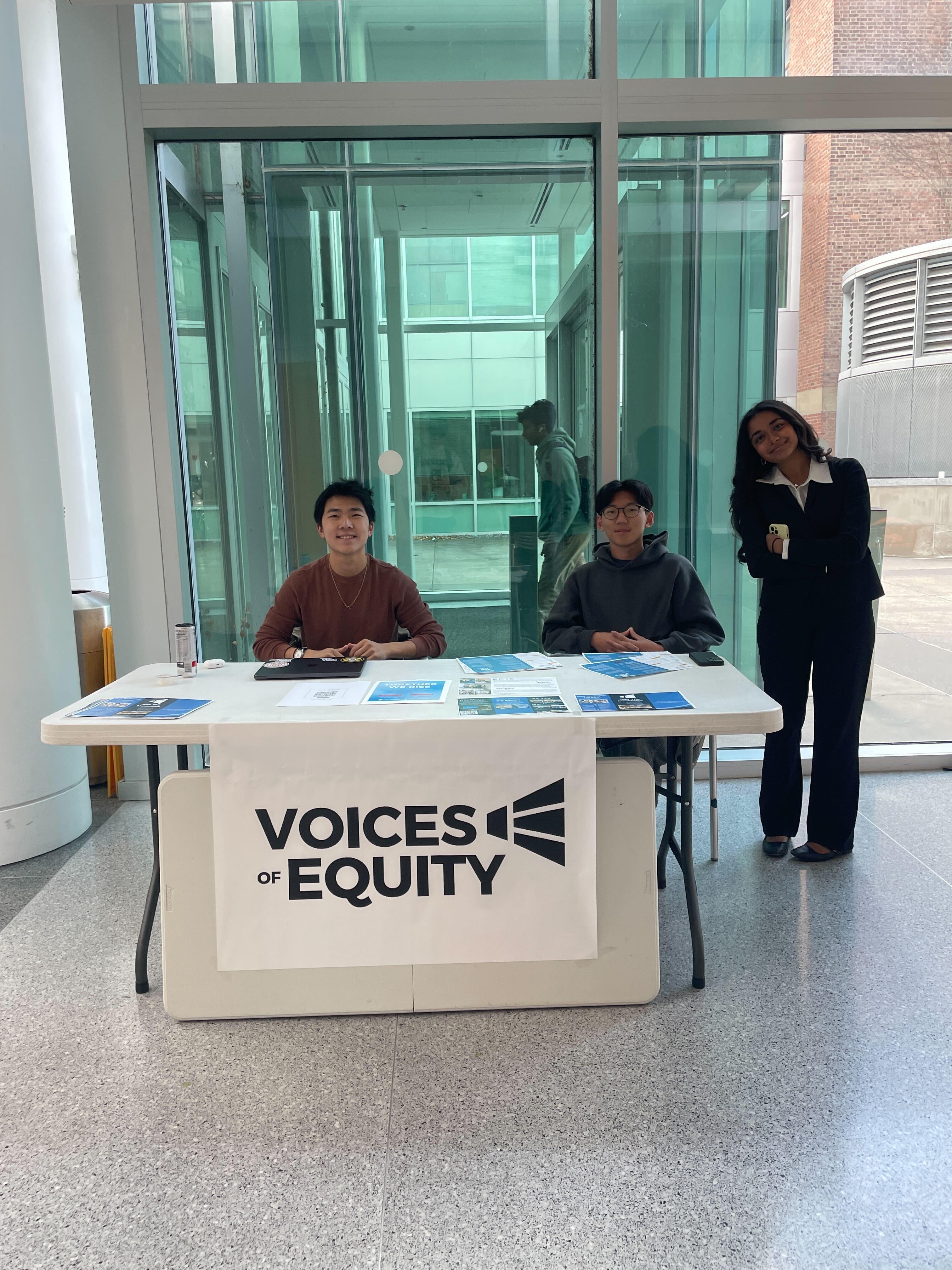 Chapter members at a campus table